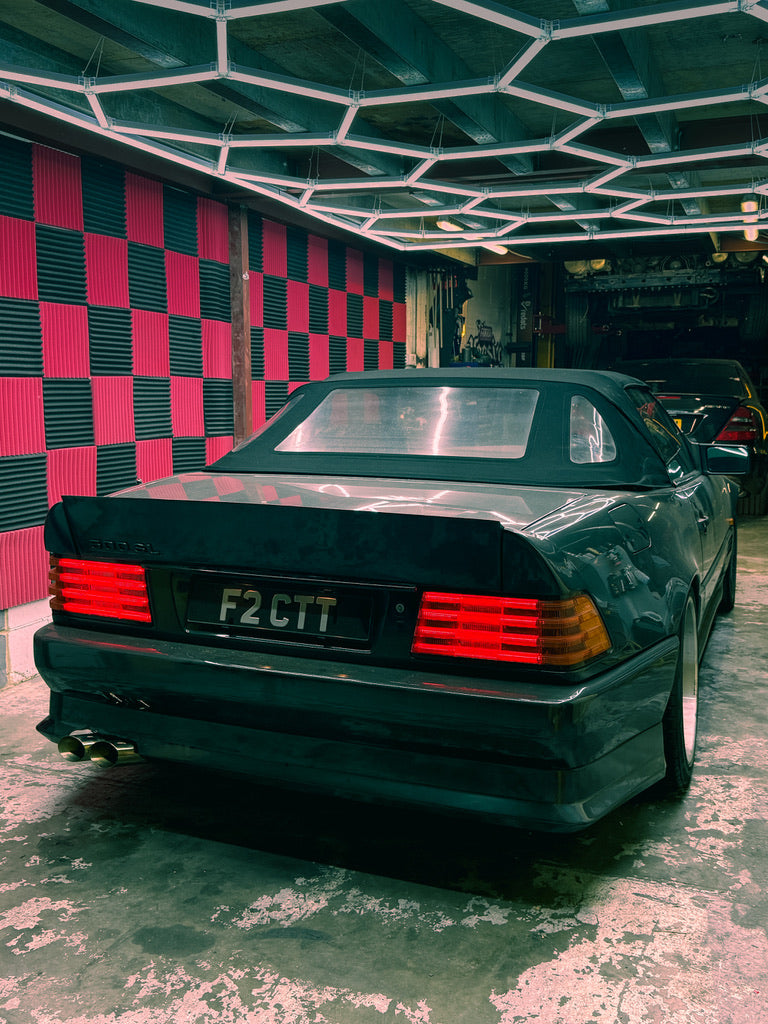 Mercedes-Benz R129 SL in the Torque Asylum workshop, rear view with hardtop fitted