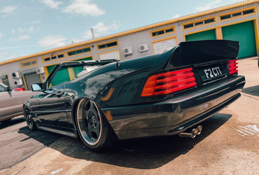 R129 rear high lift AMG duck spoiler fitted to a Mercedes-Benz SL, rear three-quarter view