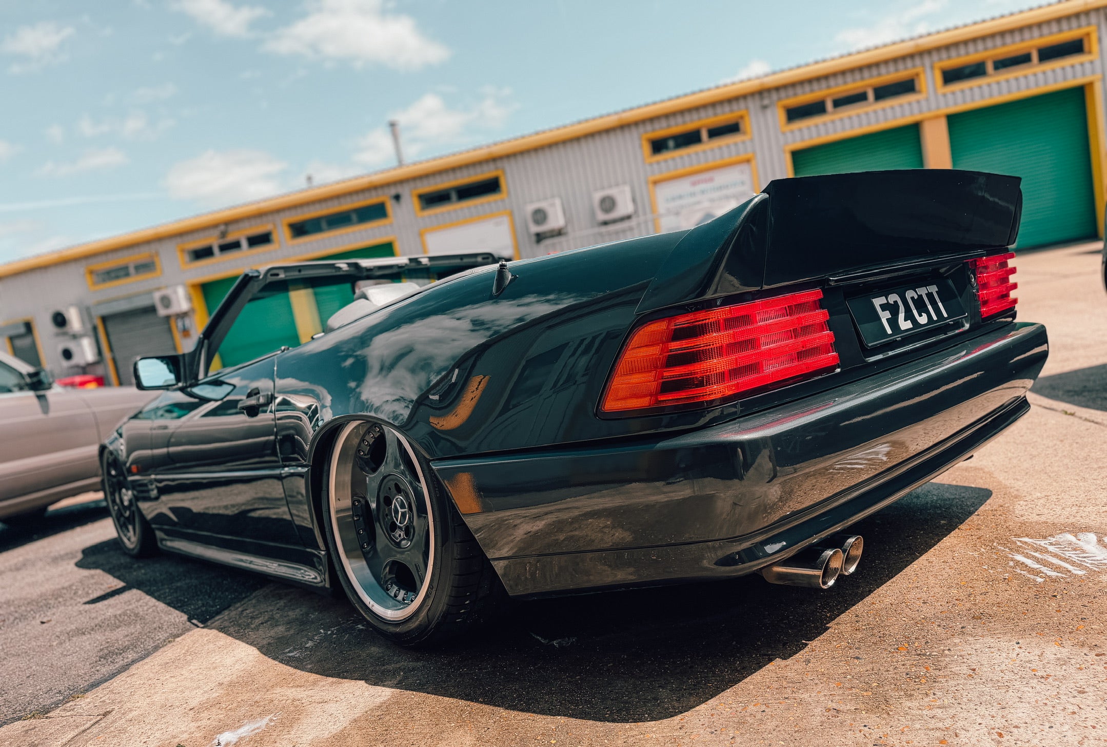 R129 rear high lift AMG duck spoiler fitted to a Mercedes-Benz SL, rear three-quarter view