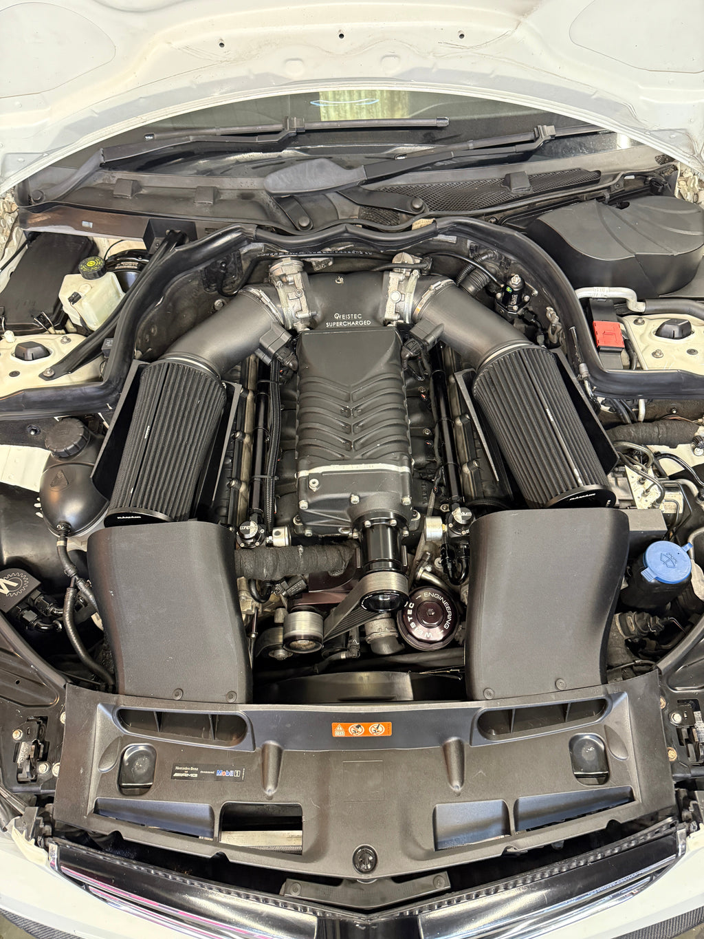 W204 C63 AMG performance inlet tubes installed with air filters